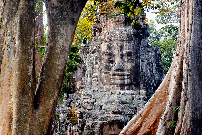 A stone tower of Victory Gate inside Angkor Thom depicts the smiling face of the king portrayed as Boddhisattava Avalokitesvara (Buddha)