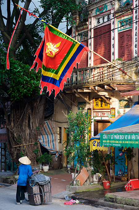 A ceremonious flag flies from a delightfull Old Quarter pagoda in Hanoi