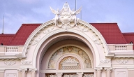 A blur of traffic passing the elegantly preserved facade of Saigon's municipal theatre