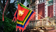 A ceremonious flag flies from a delightfull Old Quarter pagoda in Hanoi