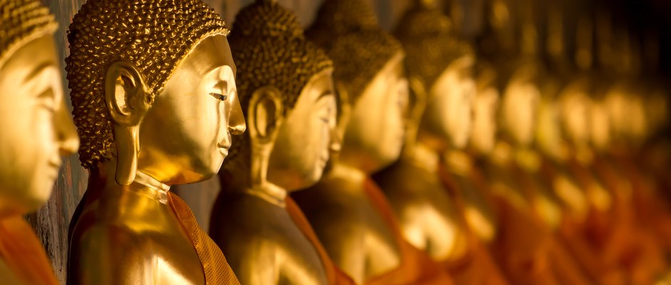 Golden Buddha statues in a line