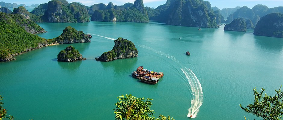Ha Long Bay islands and boats from a hilltop